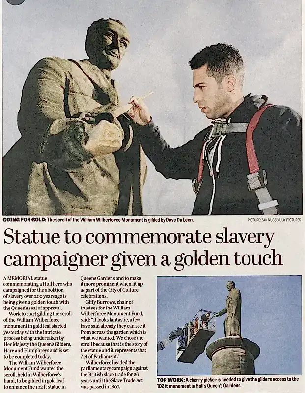 Newspaper feature covering the gilding of the William Wilberforce monument scroll